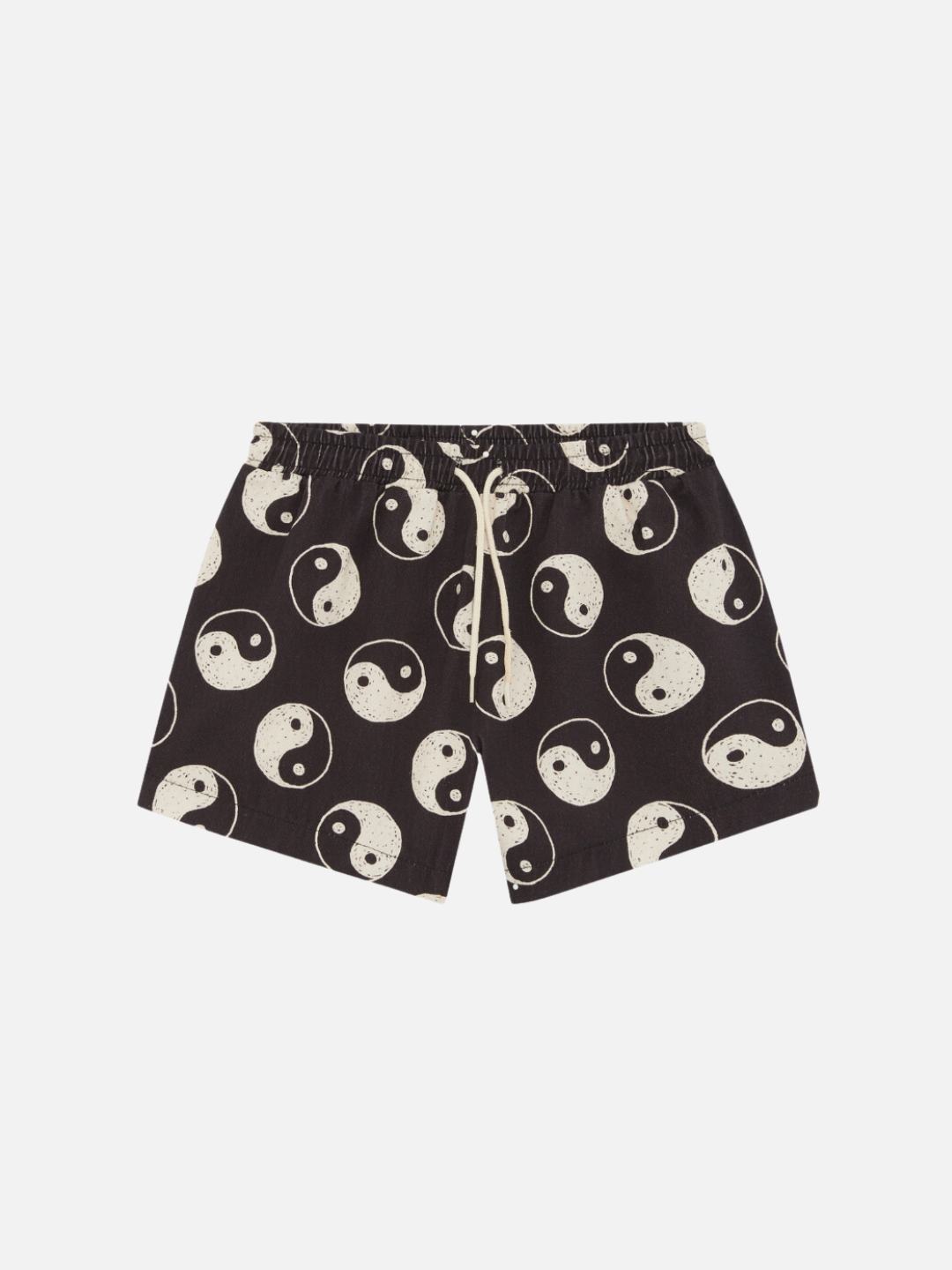 A front view of the elastic drawstring black shorts with a yin and yang pattern all over.