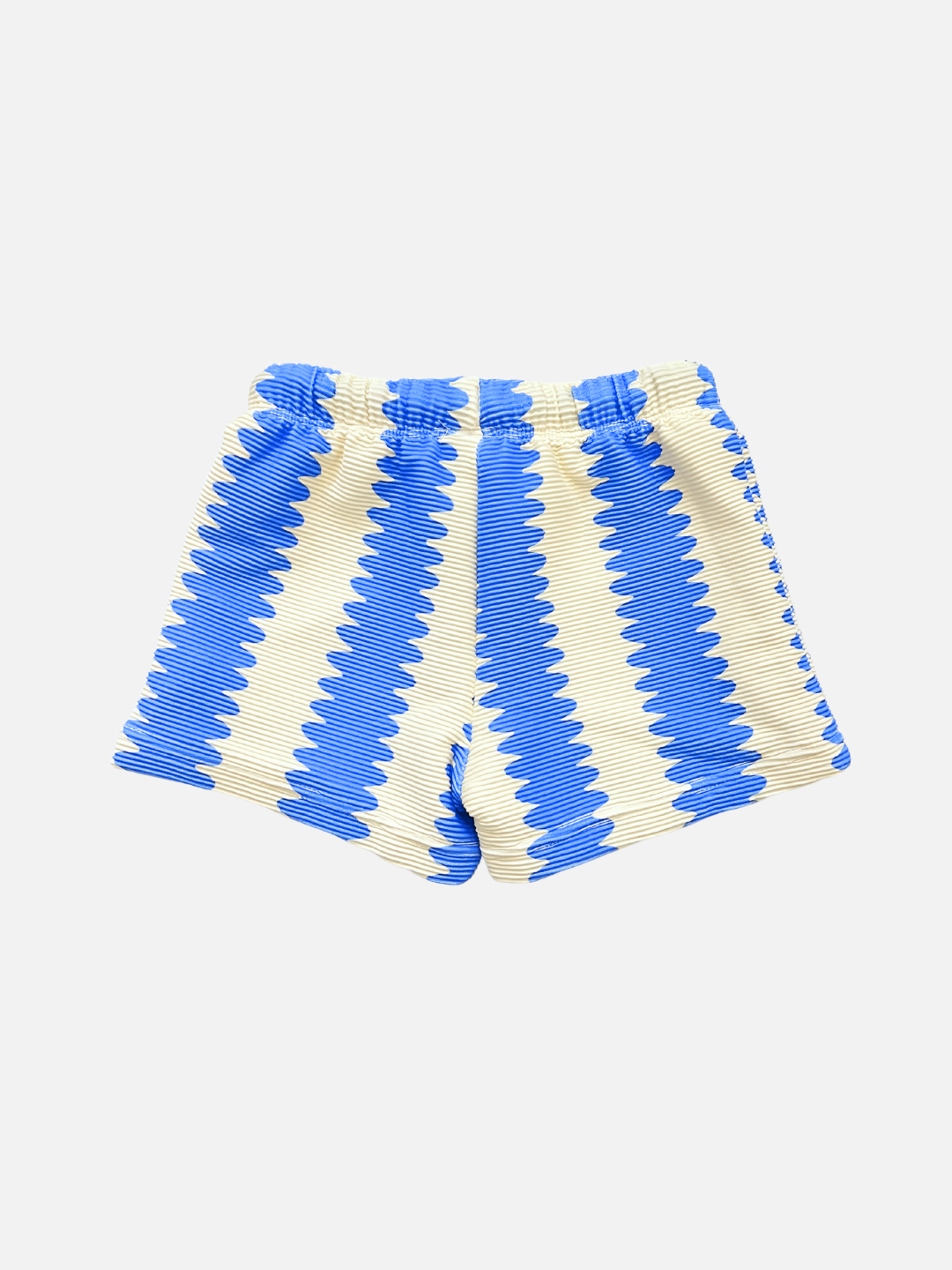 SWIM SHORTS made from recycled material with a vertical blue and white zigzag pattern, elastic waistband, no visible pockets, and UV protection. Displayed on a white background.