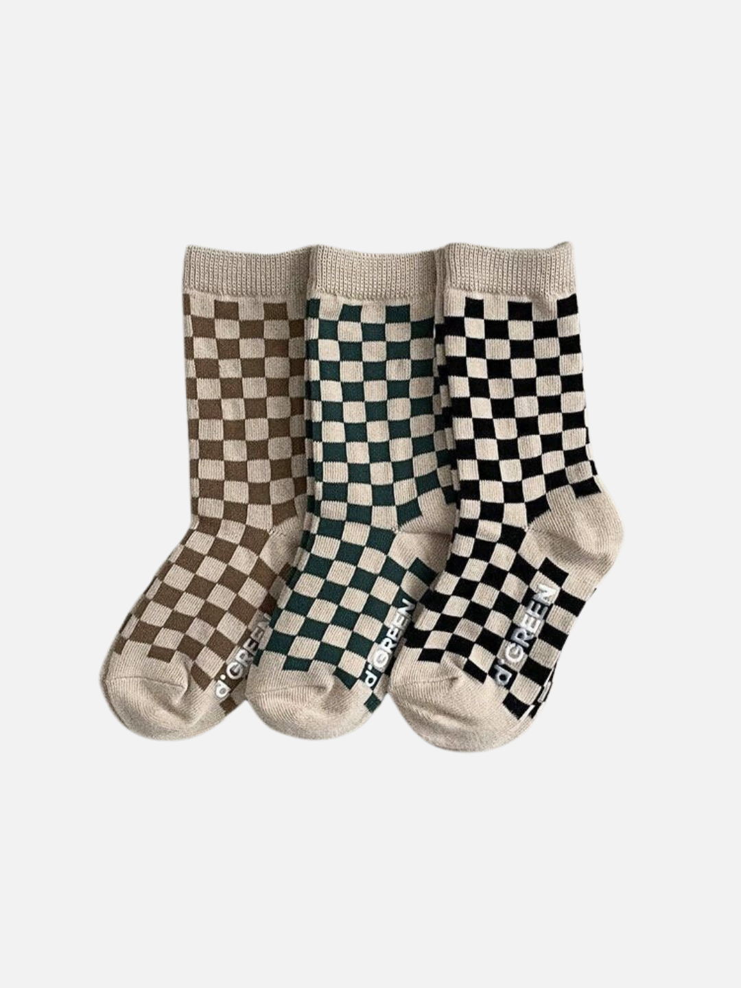 Set of three pairs of kids' checkerboard socks, in light brown, forest green, and black, on an ecru background