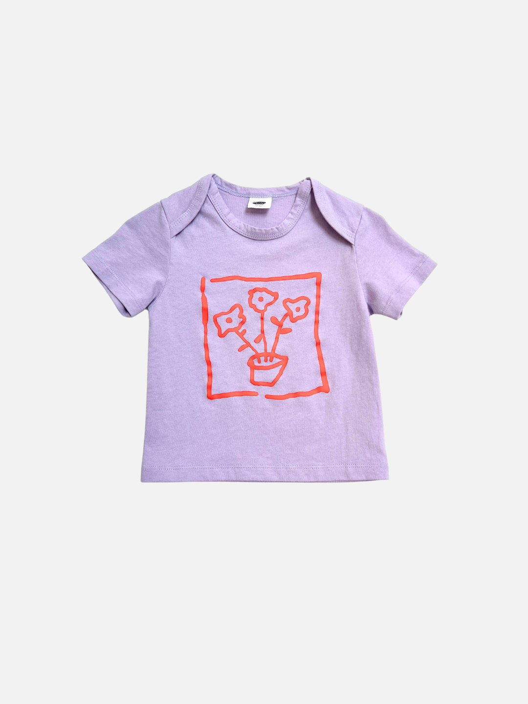 The FLOWER POT BABY TEE is a lavender short-sleeve top with a red line drawing of potted flowers inside a square frame on the chest.