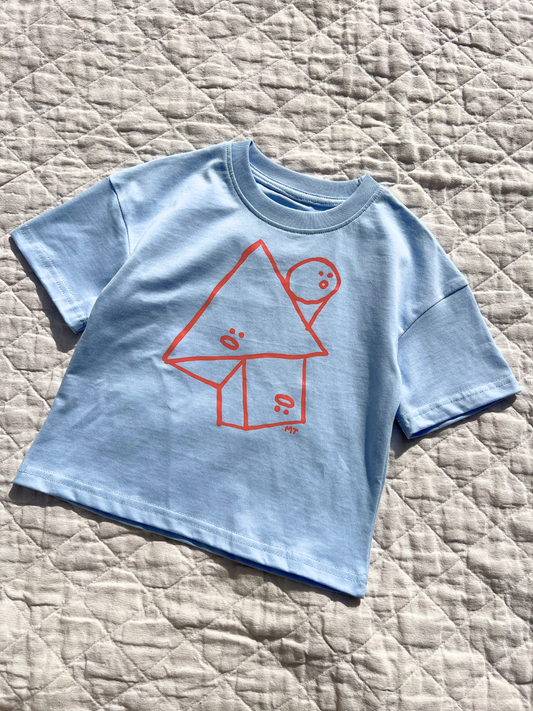 Second image of Sky Blue | A front view of the kids' Jumble Tee with red shapes outline with funny faces in the center.