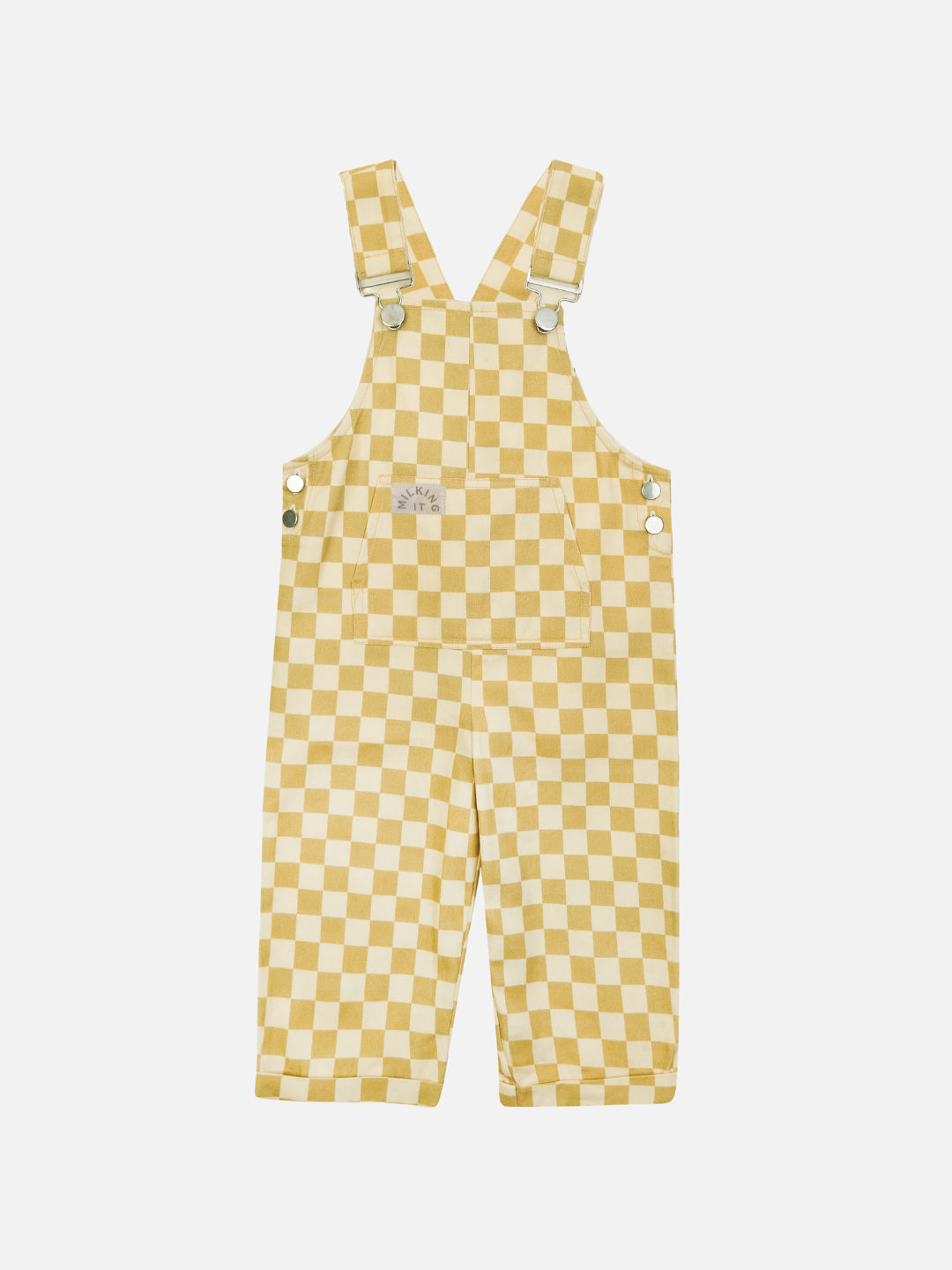 The CHECK OCHRE DUNGAREE from Claude & Co features a yellow and white checkerboard pattern, crafted from 100% organic cotton with adjustable shoulder straps, a front pocket, and side button closures. Set against a plain white background, these overalls showcase a playful yet classic design perfect for young children.