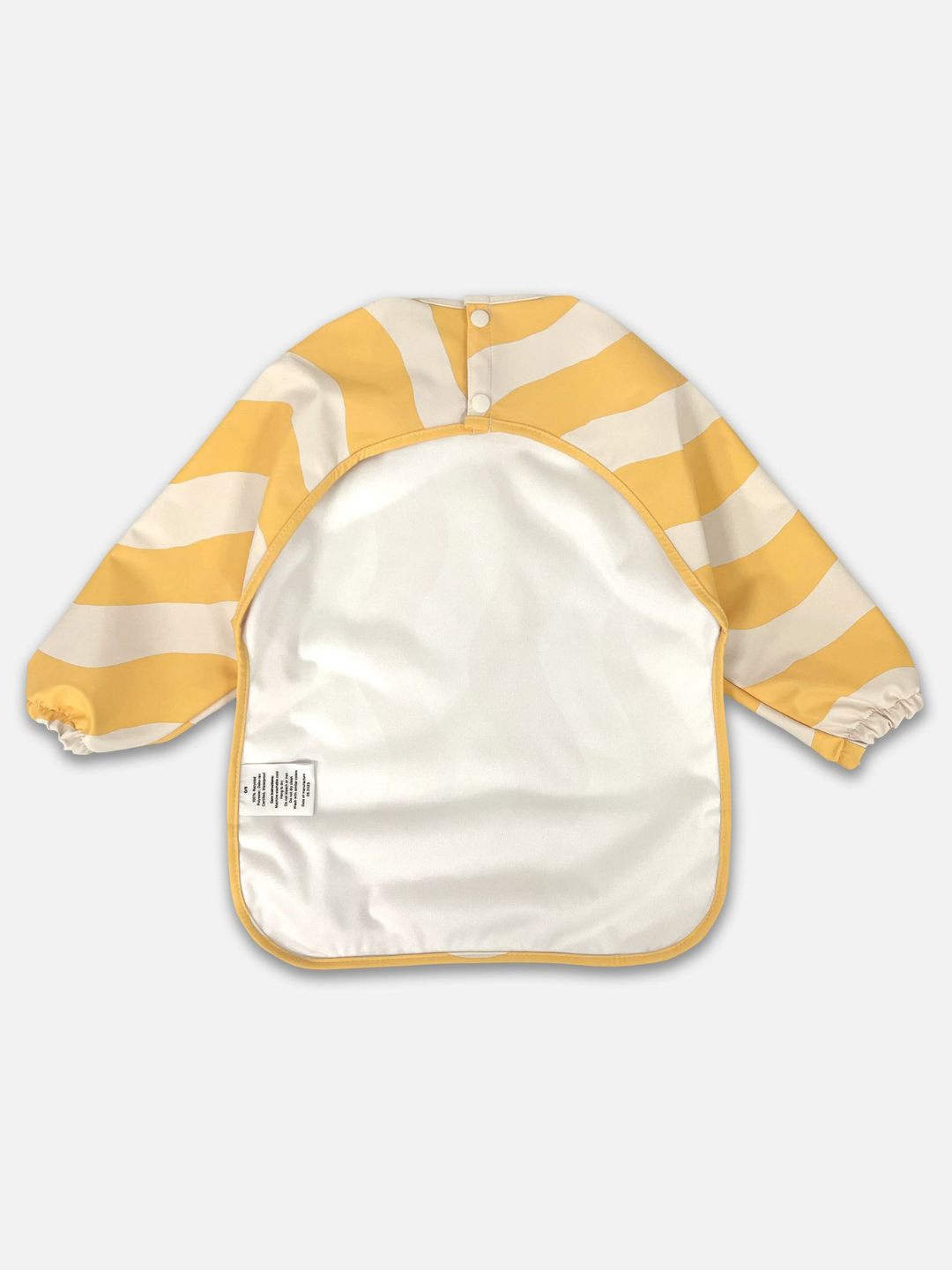 Butter Waves | Back view of the long sleeve yellow and white wavy bib and a back cut out with two buttons for closure.