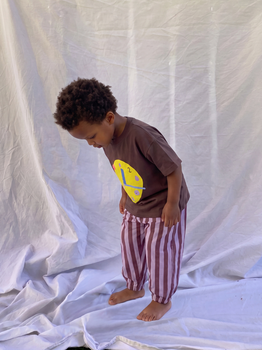 Second image of Purple Stripe | Front view of baby and toddler striped organic cotton pants in purple and burgundy, on a light grey background.