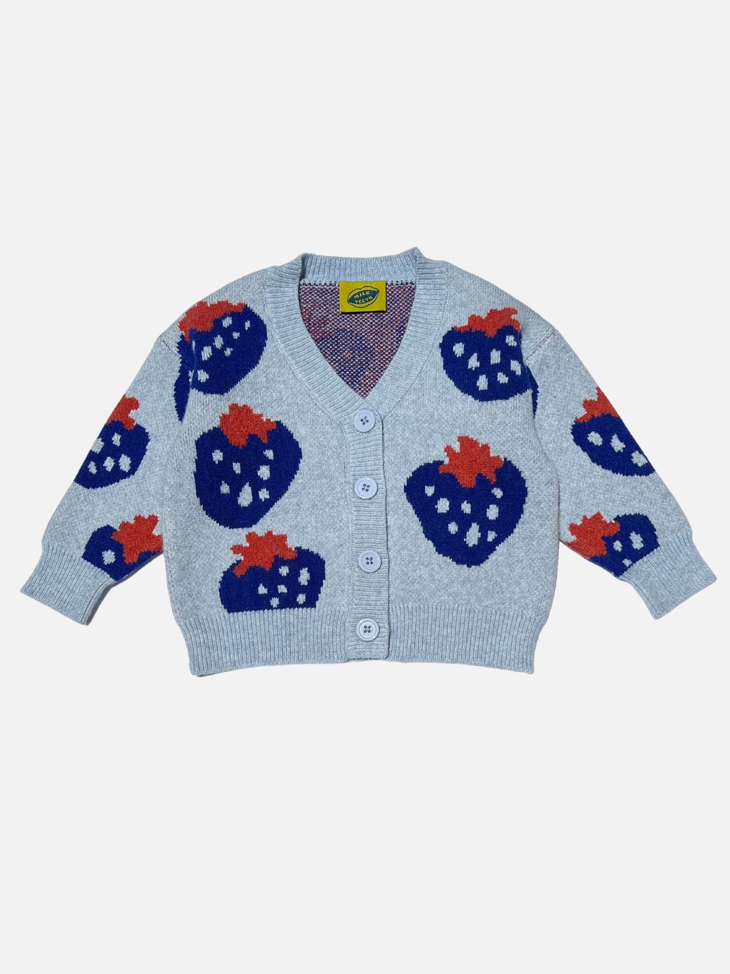Sky | Front view of a kids v-neck cardigan in light blue with an all-over pattern of large blue strawberries with a red leaf. Cardigan has 4 buttons.