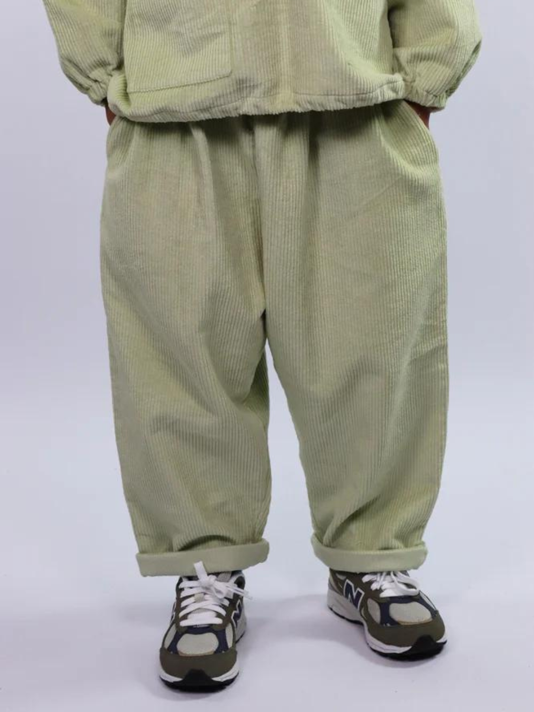 Child wearing light pistachio green kids' pants