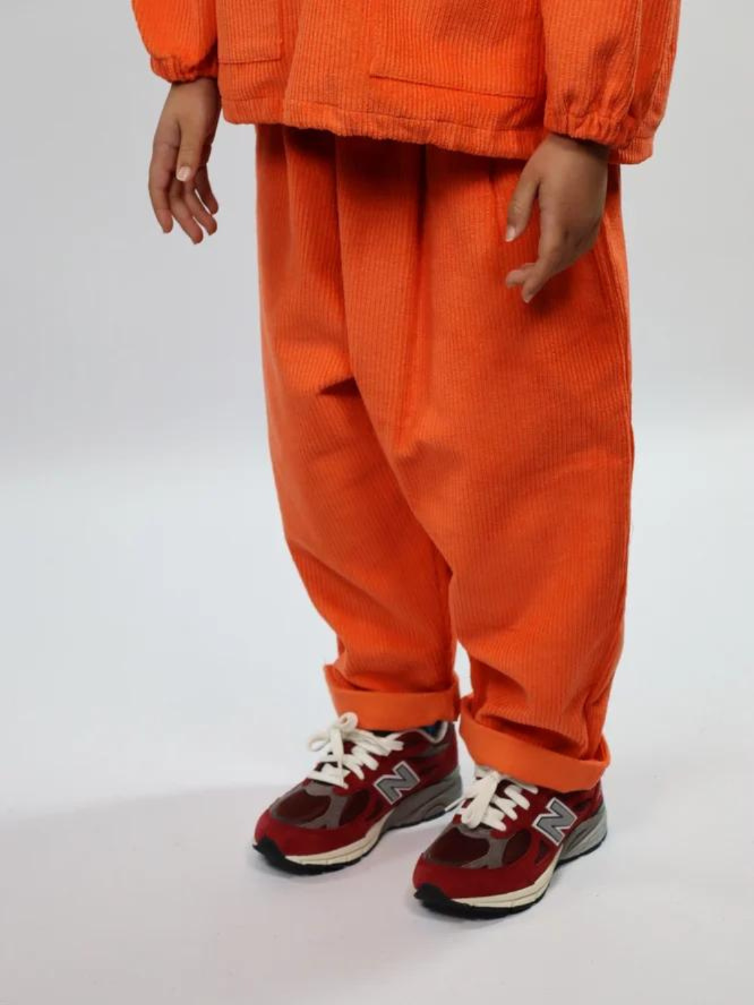 Orange | Child wearing orange kids' pants