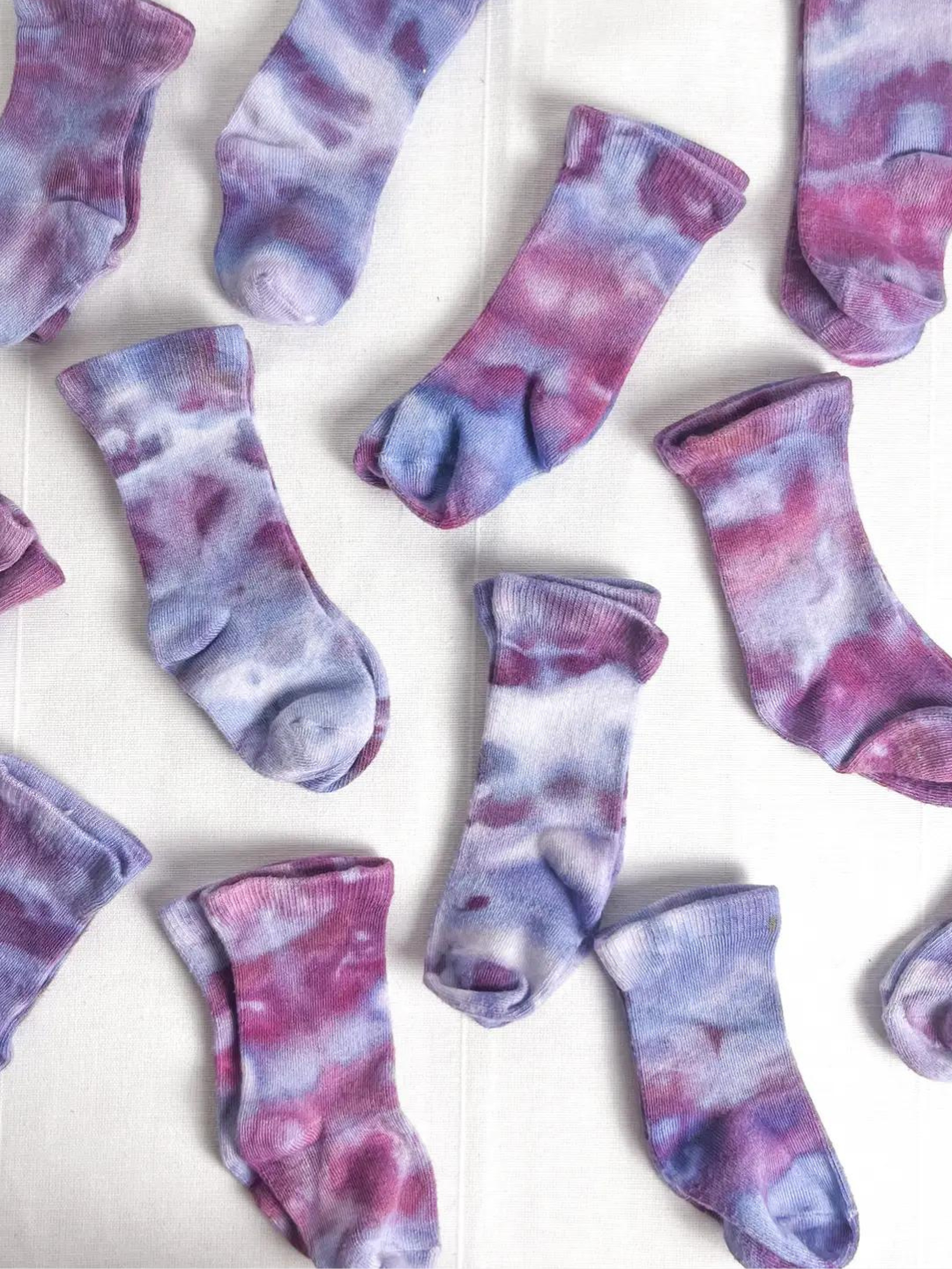 Ultraviolet | Multiple pairs of baby ankle socks in dappled shades of violet, pink and blue