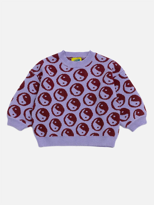 Image of A kids' sweater with dark red yin and yang circles on a violet background, front view