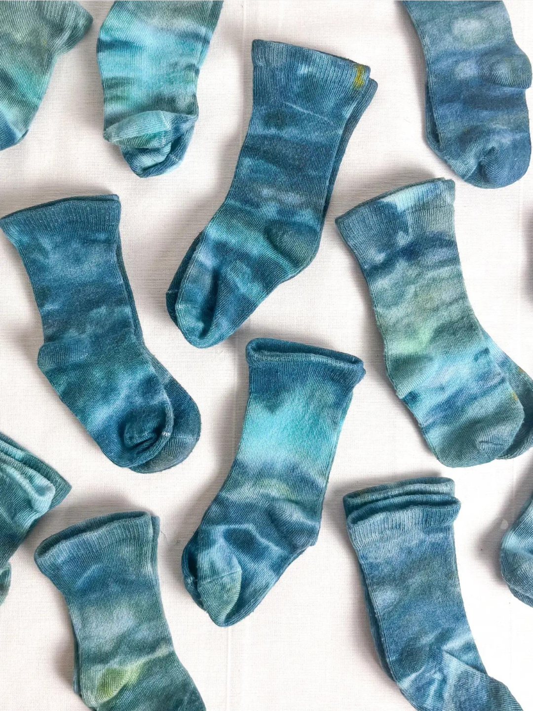 Blue Lagoon | Multiple pairs of baby ankle socks in dappled shades of blue and green