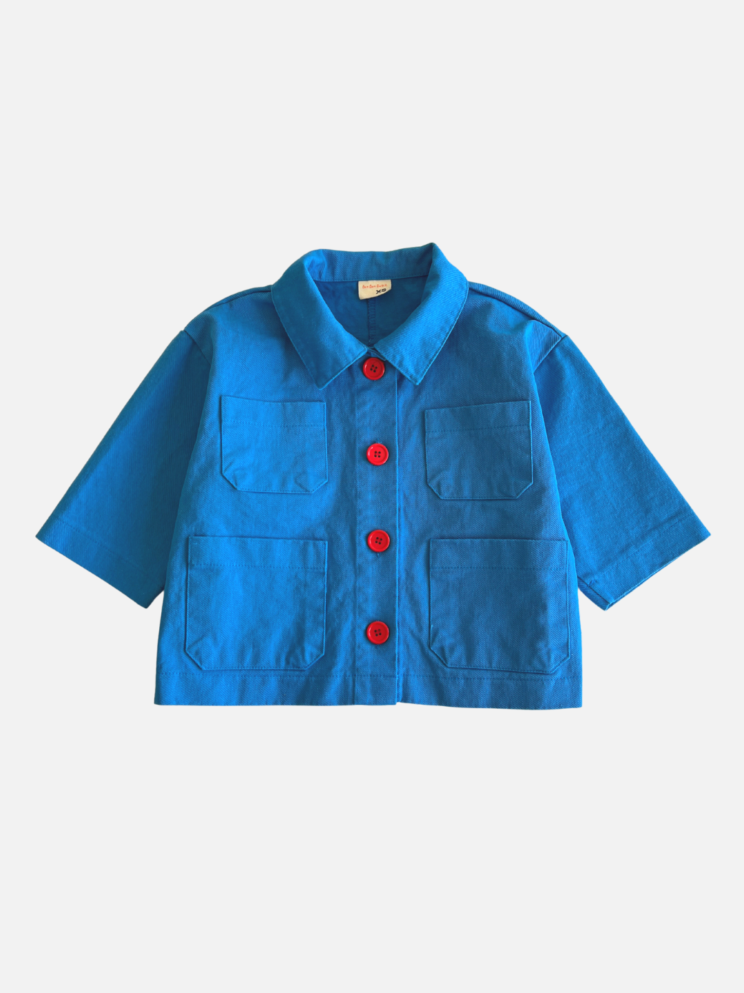 Blue | A kids' sky blue jacket with four pockets and four orange buttons