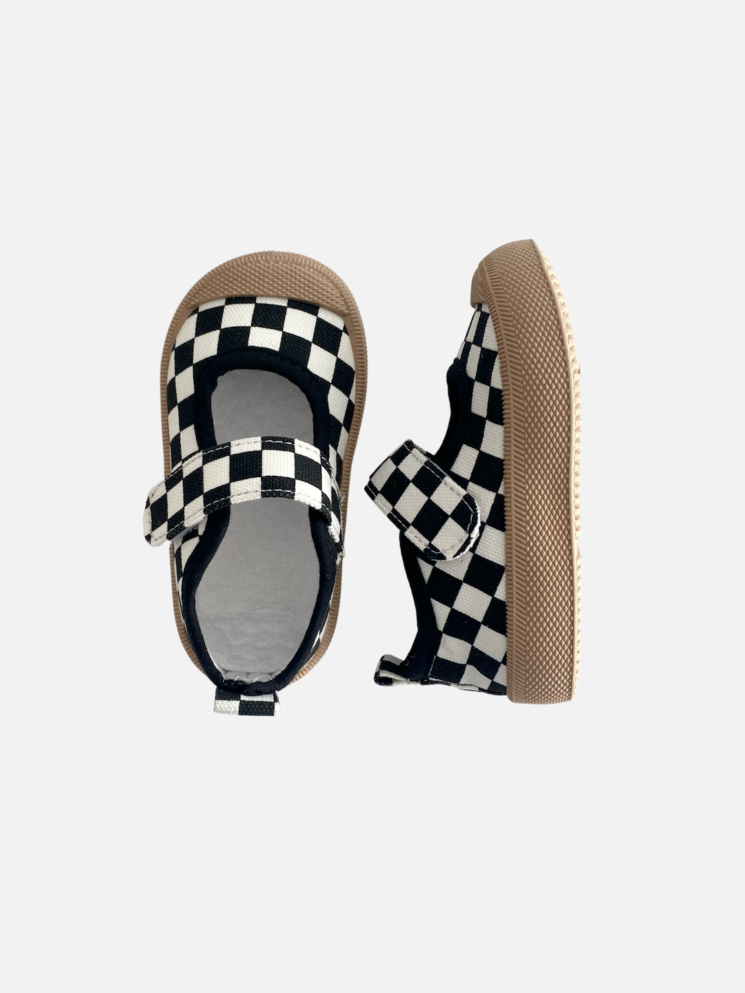 A pair of toddler mary jane sneakers in a black-and-white checkerboard, top and side view