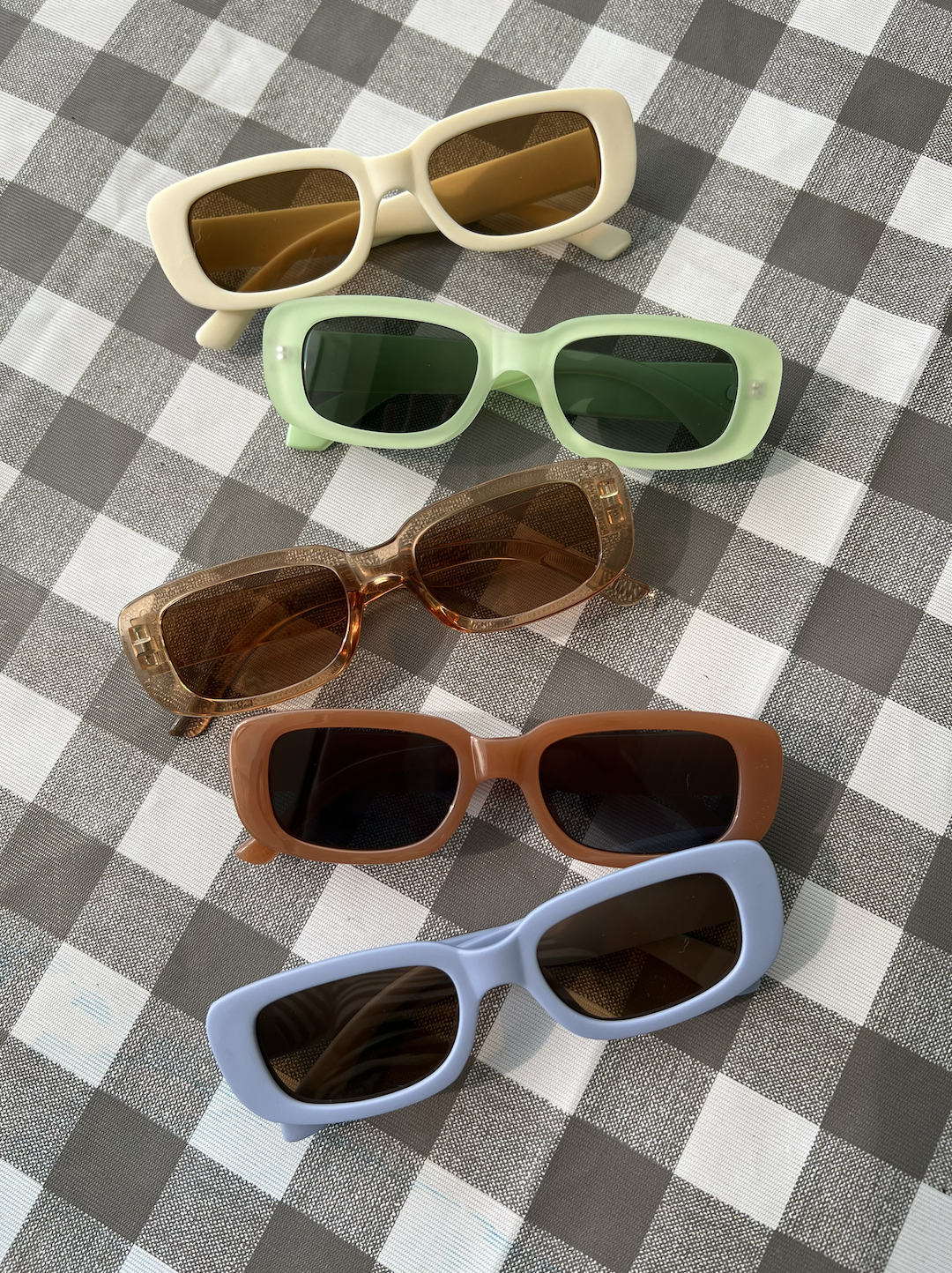 A selection of kids' sunglasses in various colors
