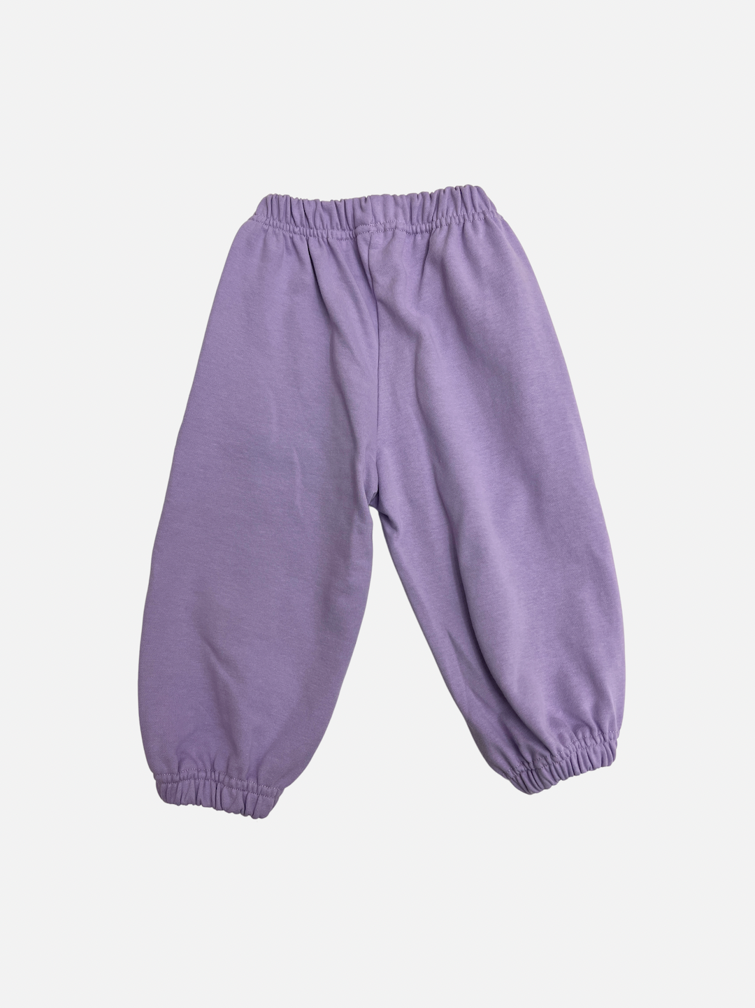 A pair of kids' sweatpants in pale purple, back view