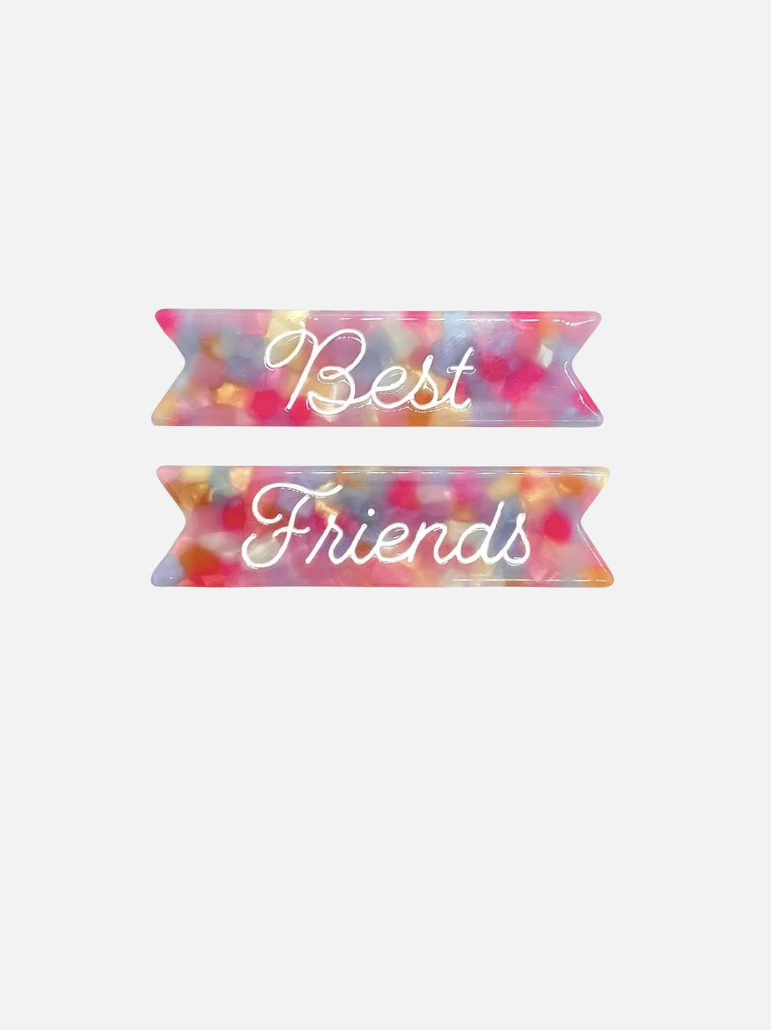 Two kids' hair clips, one with Best written on pink and blue background, one with Friends