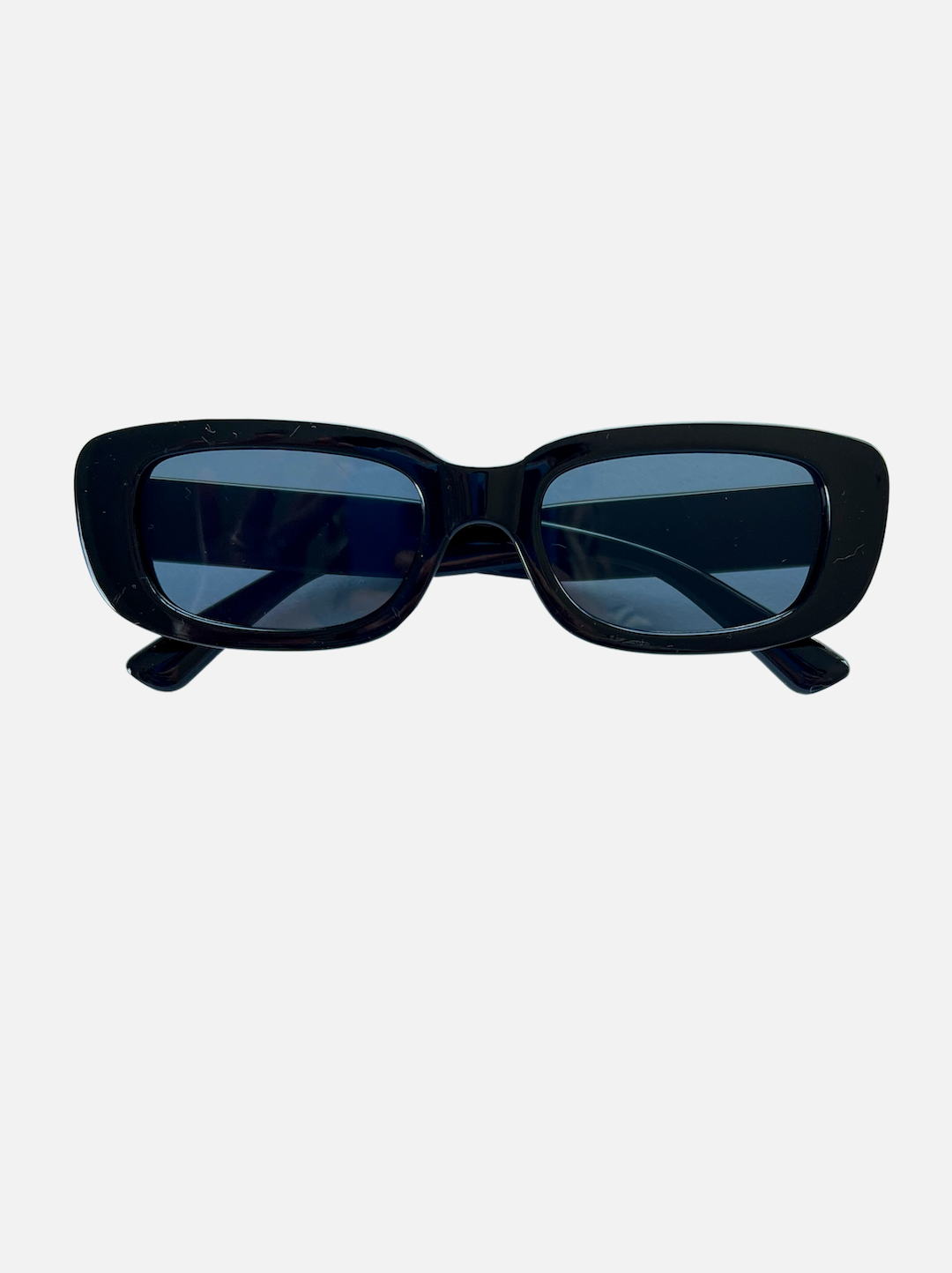 A pair of kids' sunglasses with blue lenses inside black frames