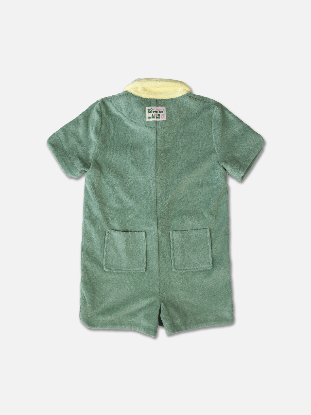 A pale green kids' jumpsuit with yellow collar and two back pockets, rear view