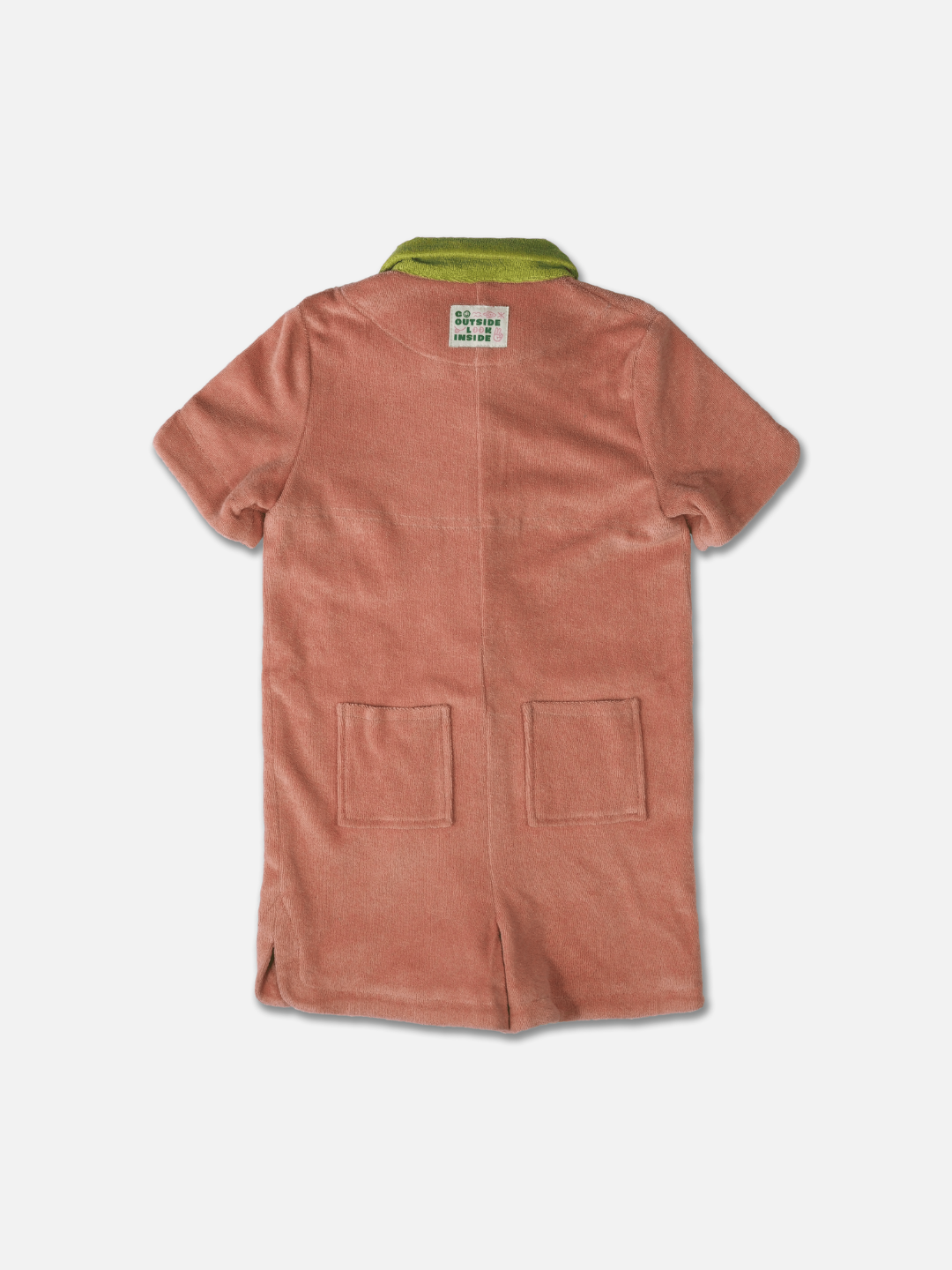 Rear view of a kids' jumpsuit in peach, with lime green collar and two back pockets